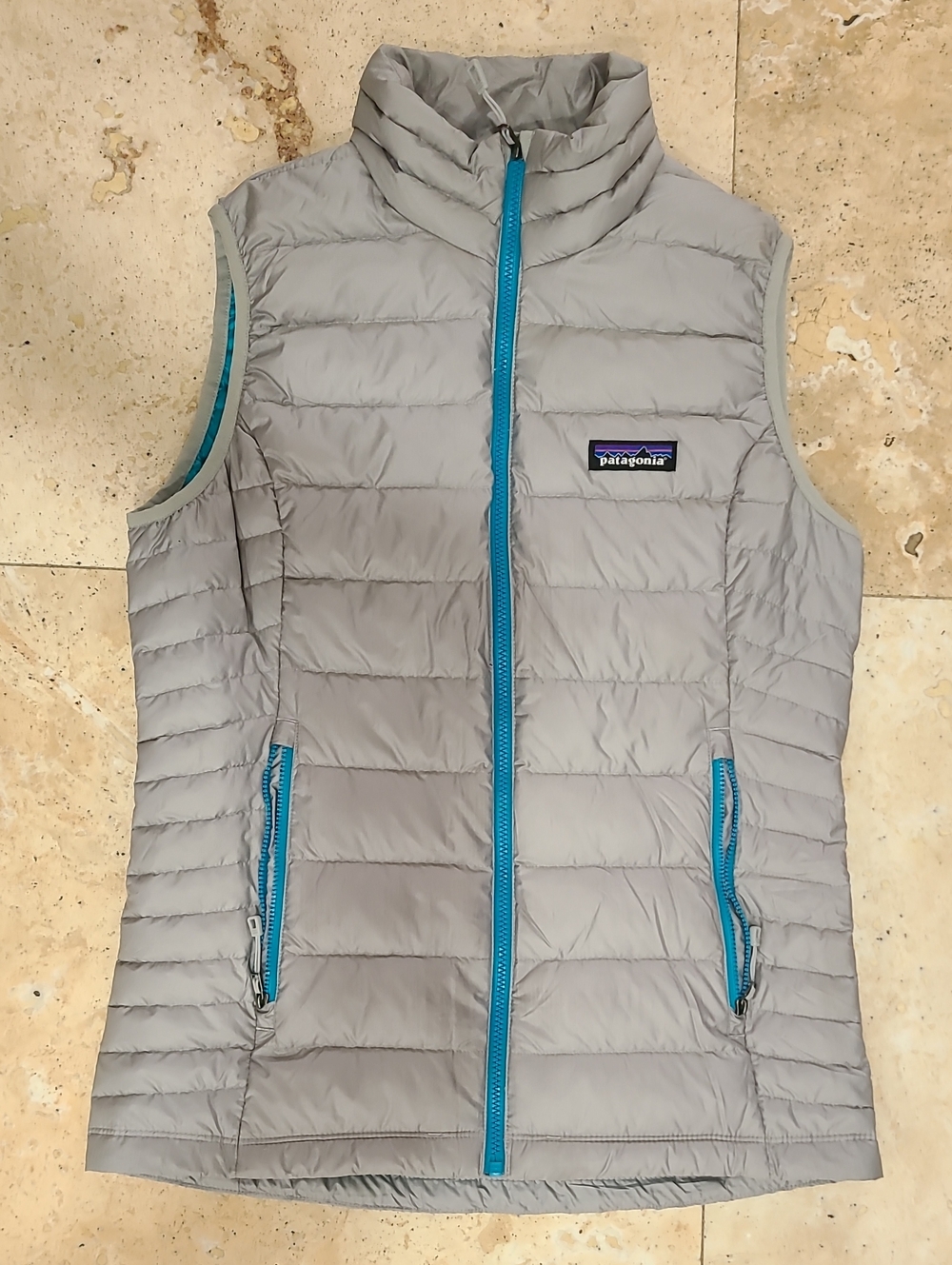 Patagonia Light Gray Quilted Vest with Teal Blue Trim